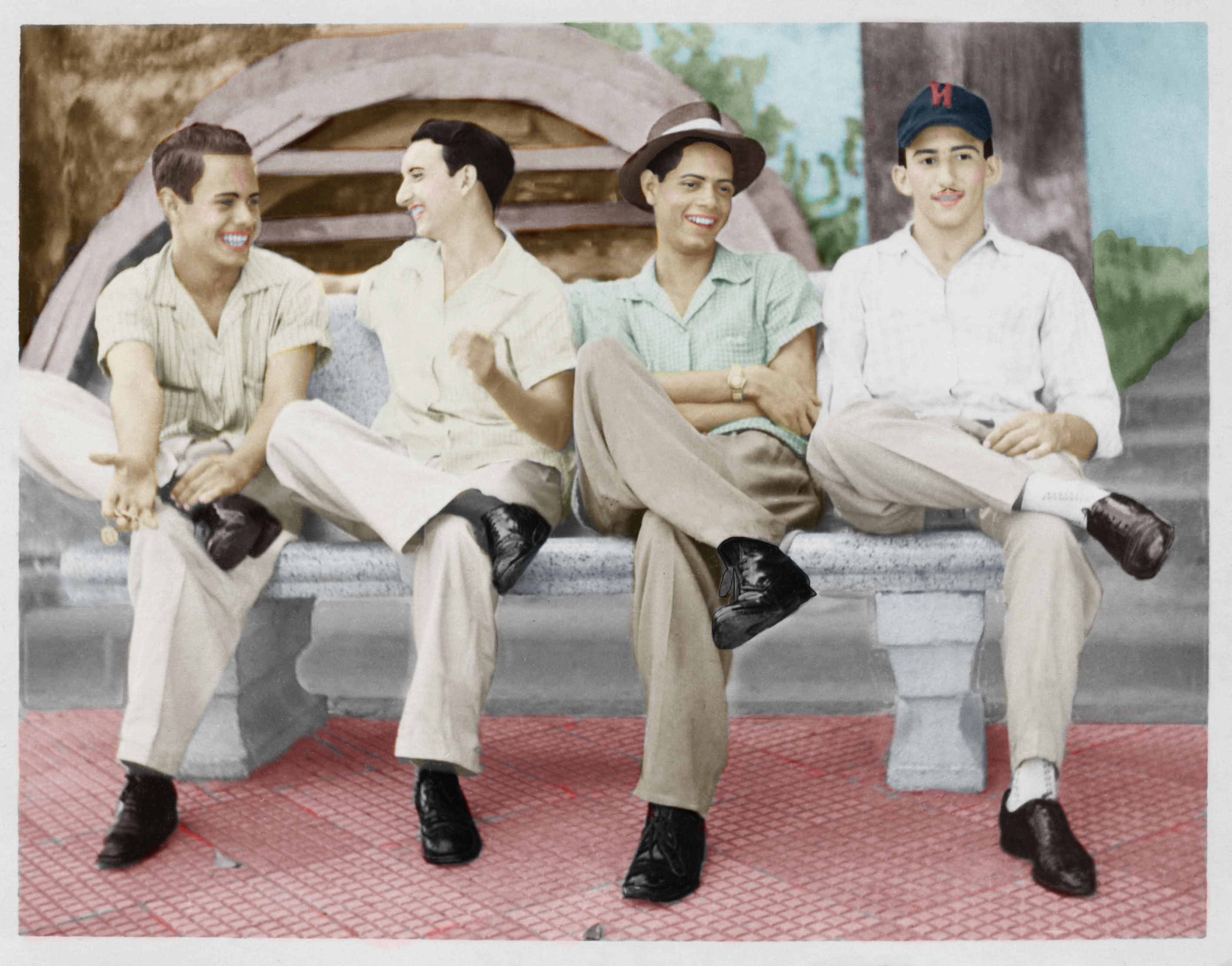An old family photo of four men redone in color